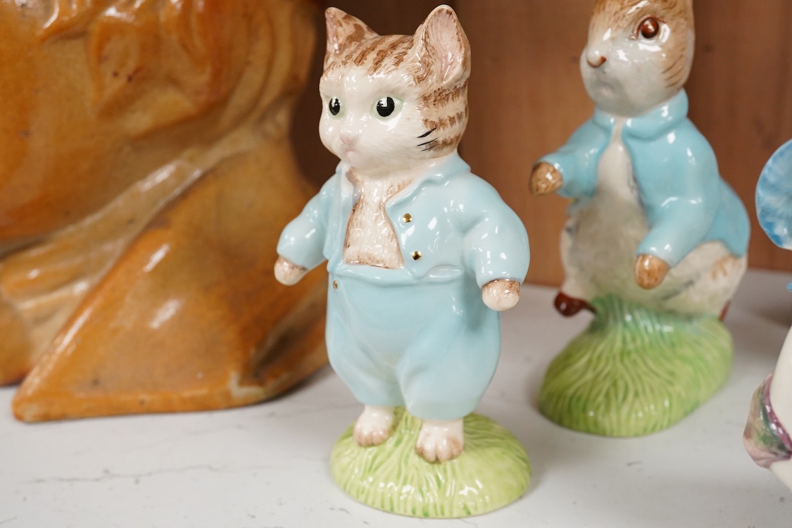 Nine Beswick Beatrix Potter figures, some stamped F. Warne & Co , largest 17cm high